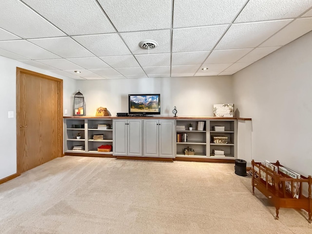 sitting room with a paneled ceiling, recessed lighting, visible vents, light carpet, and baseboards