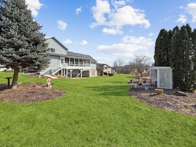 view of yard featuring a sunroom