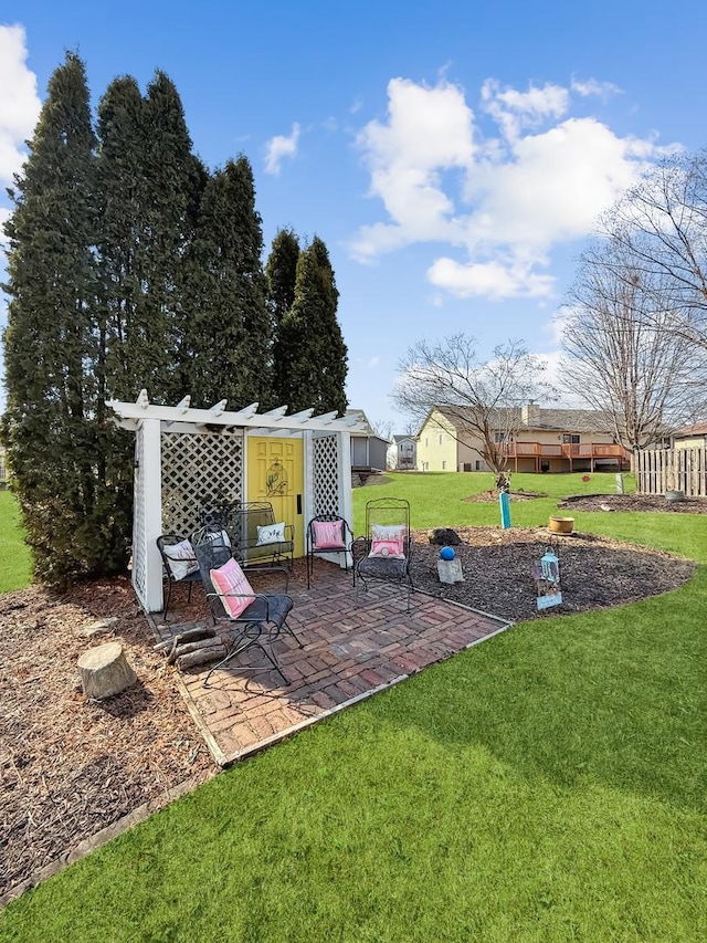 view of playground featuring a patio and a yard