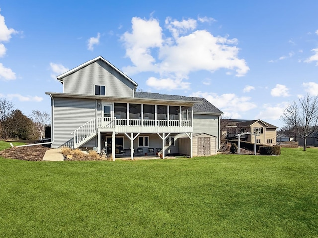 rear view of property with a storage shed, an outdoor structure, a sunroom, stairs, and a yard