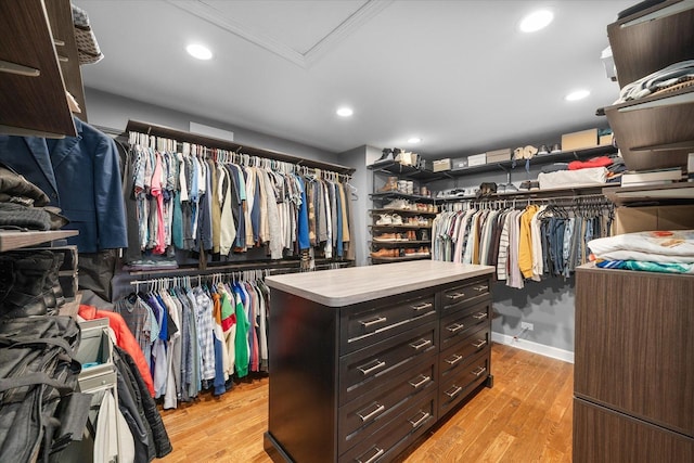 spacious closet featuring light wood-style flooring