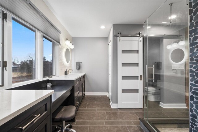 bedroom with a ceiling fan, wood finished floors, and baseboards