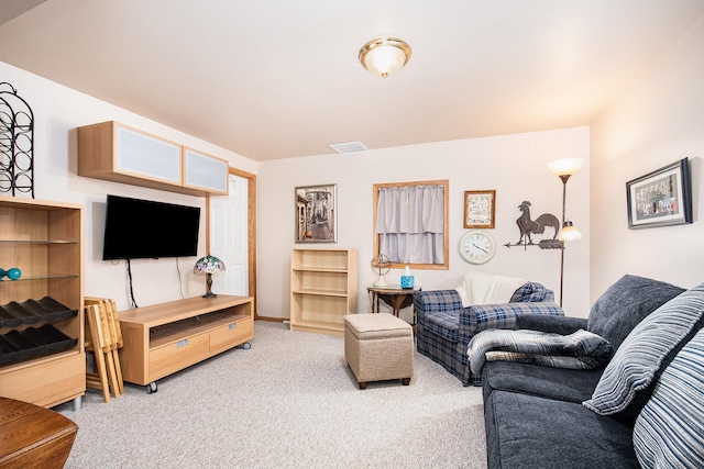 living area featuring carpet and visible vents