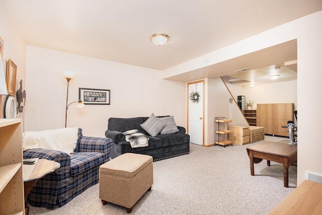 living room featuring visible vents, stairway, and carpet flooring