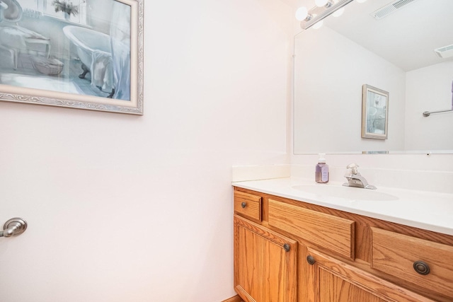 bathroom with visible vents and vanity