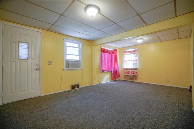 interior space featuring cooling unit and a drop ceiling