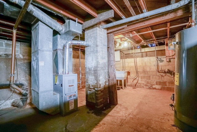 unfinished basement with water heater and a sink