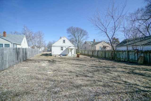 view of yard featuring an outbuilding and fence private yard