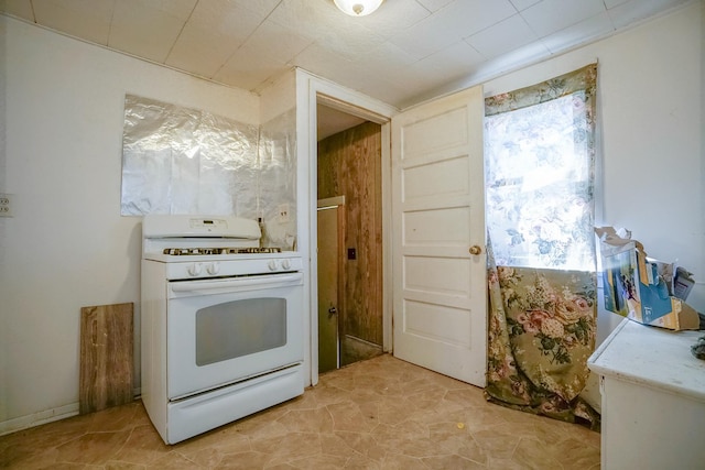 kitchen with white gas stove