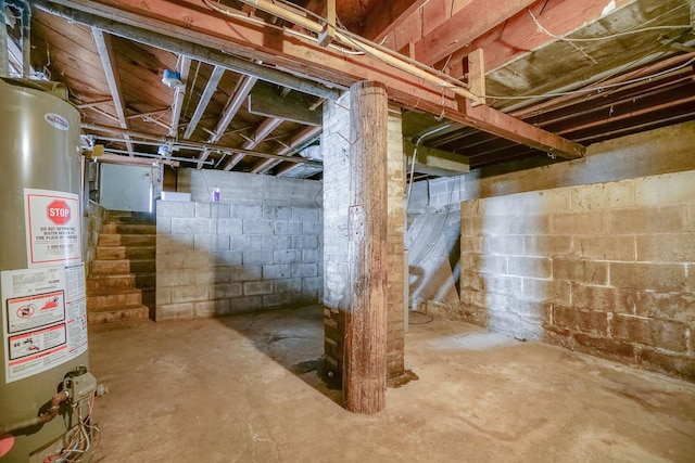 unfinished basement with gas water heater