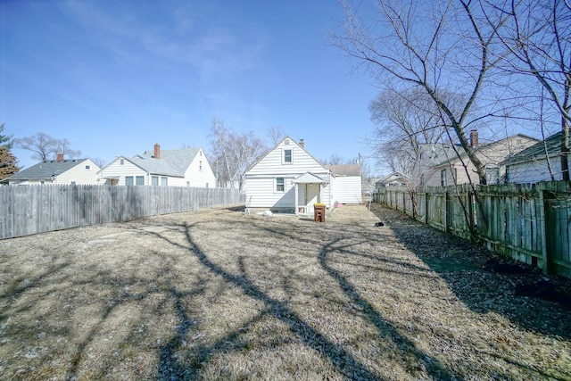 view of yard with a fenced backyard