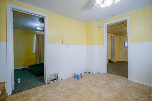 spare room featuring light colored carpet