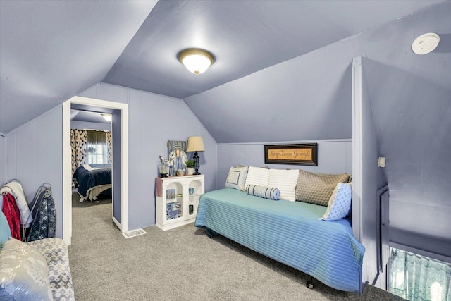 carpeted bedroom featuring vaulted ceiling