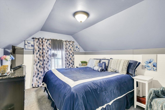 bedroom featuring carpet floors and vaulted ceiling