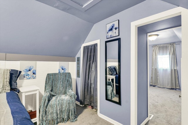 bedroom featuring lofted ceiling, carpet, and baseboards