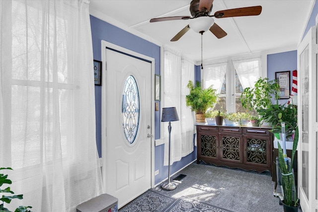 entrance foyer with visible vents and carpet floors