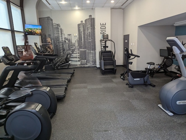 gym featuring a drop ceiling and recessed lighting