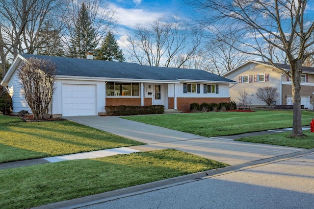 single story home with a front yard, a chimney, concrete driveway, a garage, and brick siding