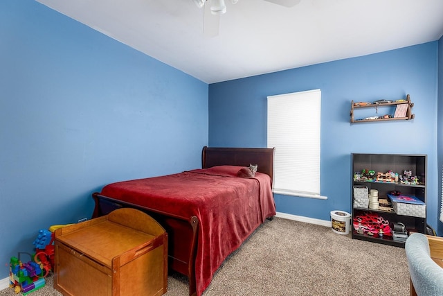 bedroom featuring a ceiling fan, baseboards, and carpet