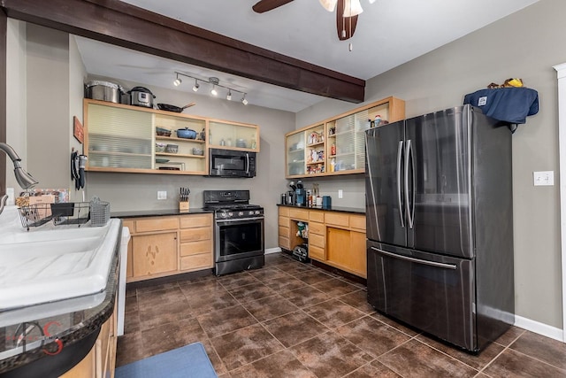 kitchen featuring light brown cabinetry, dark countertops, open shelves, stainless steel appliances, and baseboards