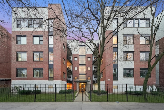 view of building exterior featuring a fenced front yard