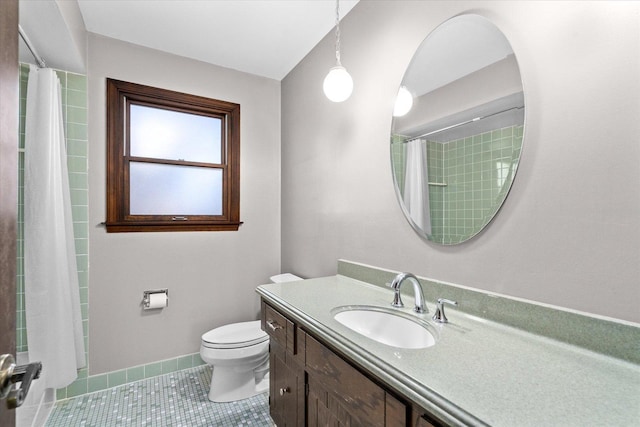 full bathroom with a shower with curtain, toilet, tile patterned flooring, baseboards, and vanity