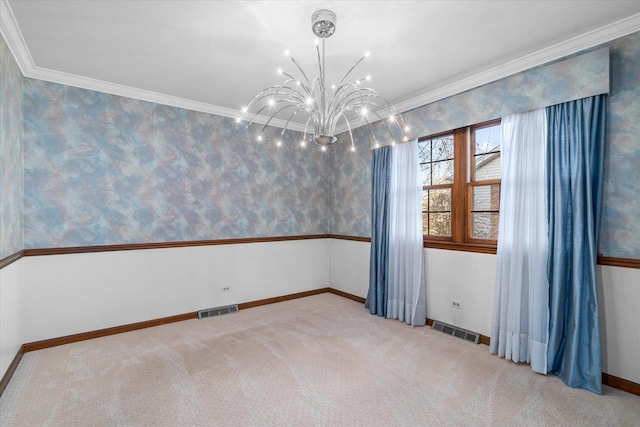 carpeted spare room featuring visible vents, a chandelier, crown molding, and wallpapered walls