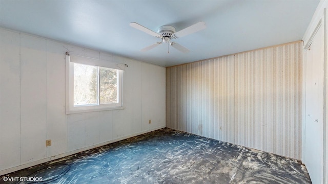 unfurnished room with ceiling fan