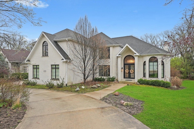 11735 Orchard St, Willow Springs, IL 60480 - view of front of property with a front lawn, a shingled roof, and french doors