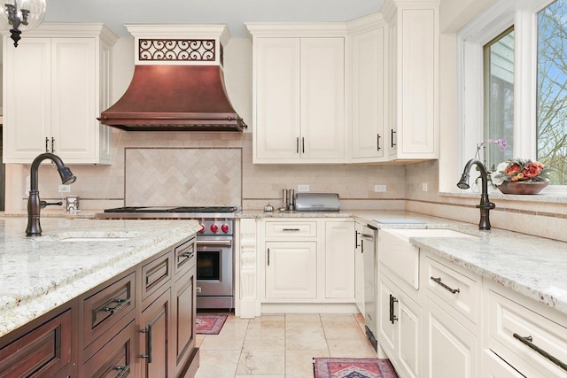 11735 Orchard St, Willow Springs, IL 60480 - kitchen featuring stainless steel appliances, a sink, decorative backsplash, custom range hood, and light stone countertops