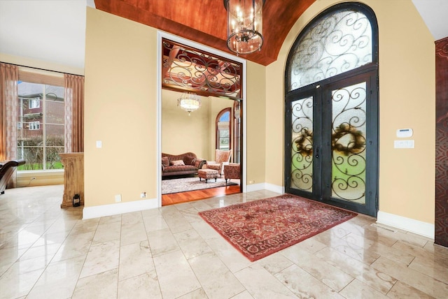 11735 Orchard St, Willow Springs, IL 60480 - entrance foyer with a high ceiling, marble finish floor, french doors, baseboards, and a notable chandelier