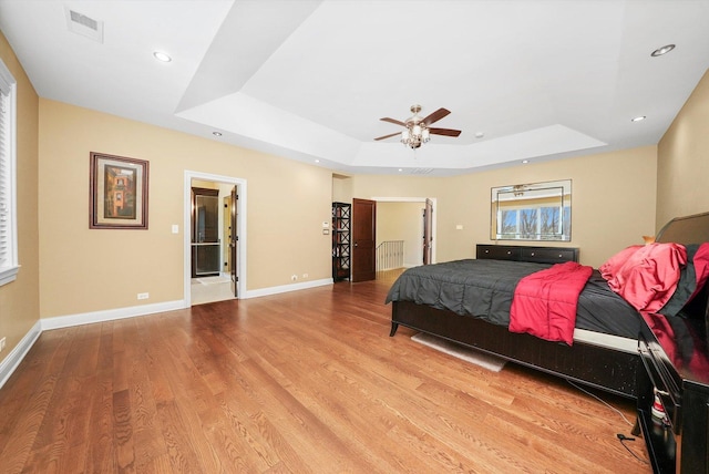 11735 Orchard St, Willow Springs, IL 60480 - bedroom with wood finished floors, a raised ceiling, baseboards, visible vents, and recessed lighting