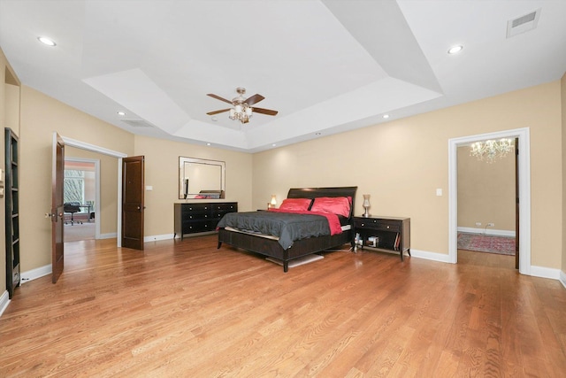 11735 Orchard St, Willow Springs, IL 60480 - bedroom with a tray ceiling, light wood finished floors, baseboards, visible vents, and recessed lighting