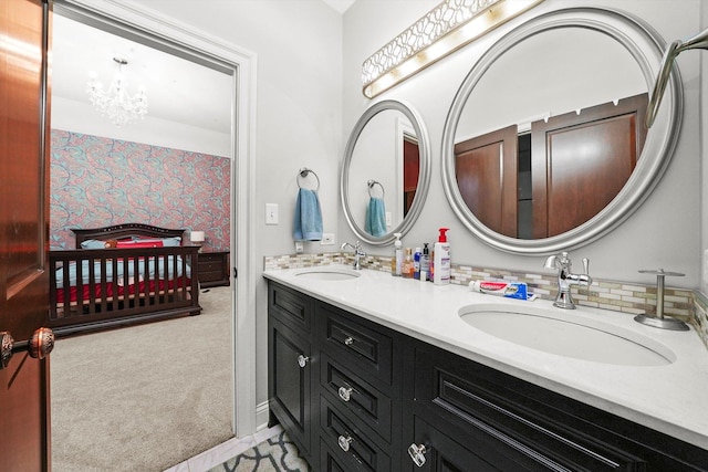 11735 Orchard St, Willow Springs, IL 60480 - full bathroom featuring an inviting chandelier, wallpapered walls, a sink, and double vanity