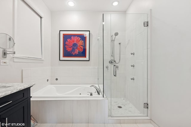 full bath featuring a bath, recessed lighting, a stall shower, and vanity