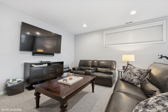 living room with recessed lighting, visible vents, light carpet, and baseboards