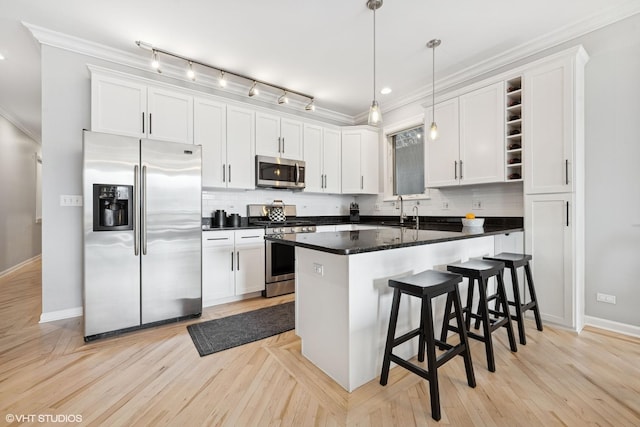 kitchen featuring open shelves, a sink, white cabinets, appliances with stainless steel finishes, and crown molding