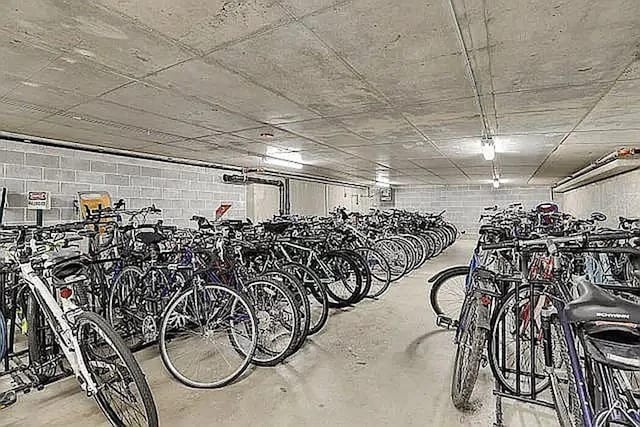 garage with concrete block wall and bike storage