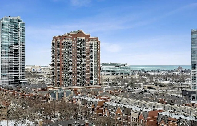 exterior space featuring a water view and a view of city