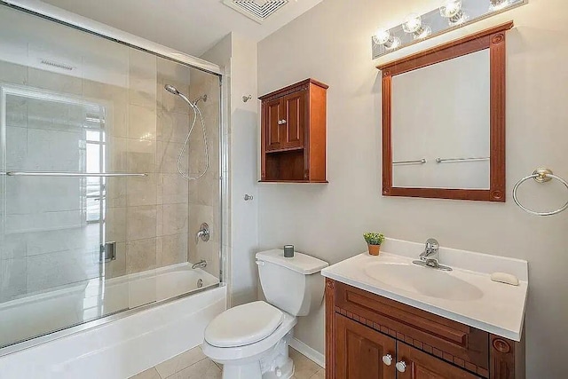 full bath featuring toilet, shower / bath combination with glass door, vanity, visible vents, and tile patterned floors