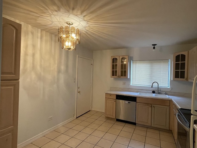 kitchen with appliances with stainless steel finishes, light countertops, a sink, and glass insert cabinets