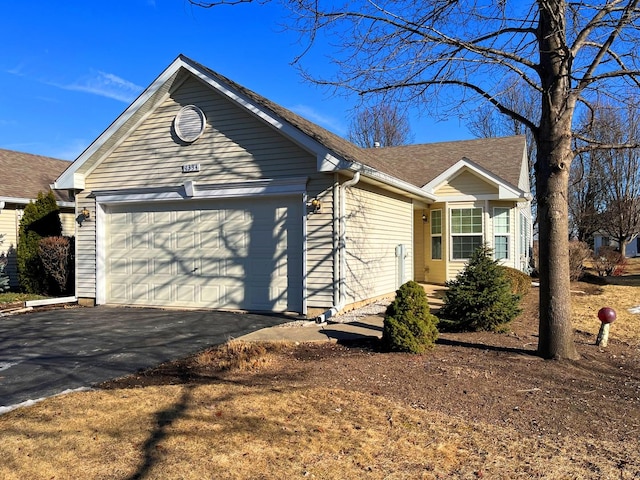 view of front of house featuring driveway and an attached garage