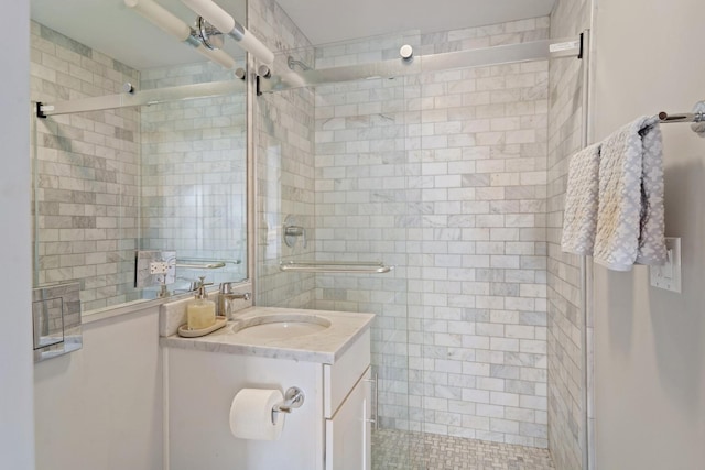 full bath featuring a shower stall and vanity