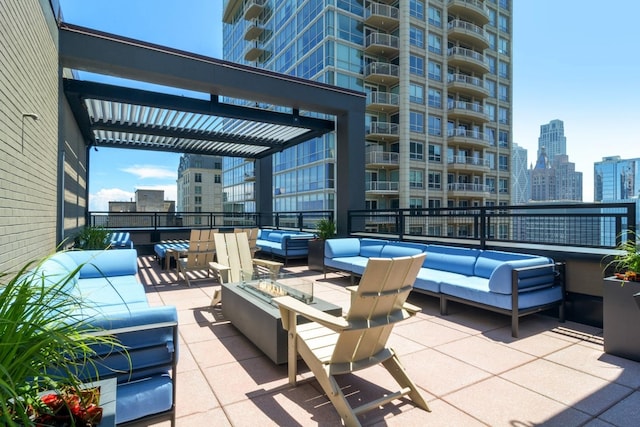 view of patio with a view of city, an outdoor living space, and a pergola