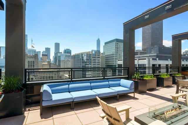 view of patio with outdoor lounge area and a city view