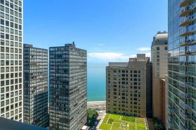 property's view of city featuring a water view