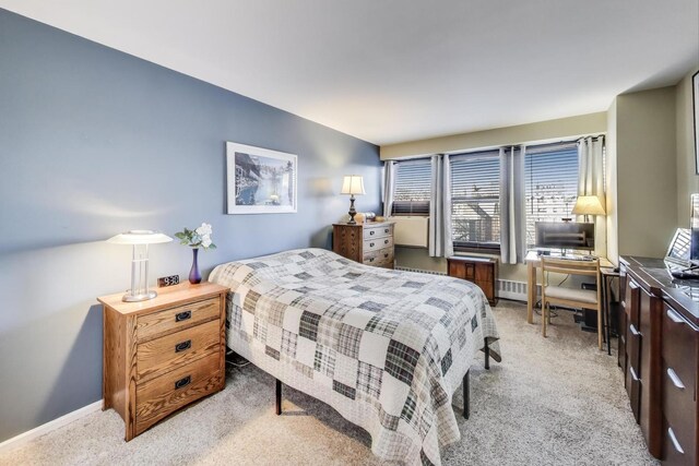bedroom featuring baseboards and carpet flooring