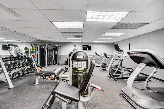 exercise room featuring a paneled ceiling