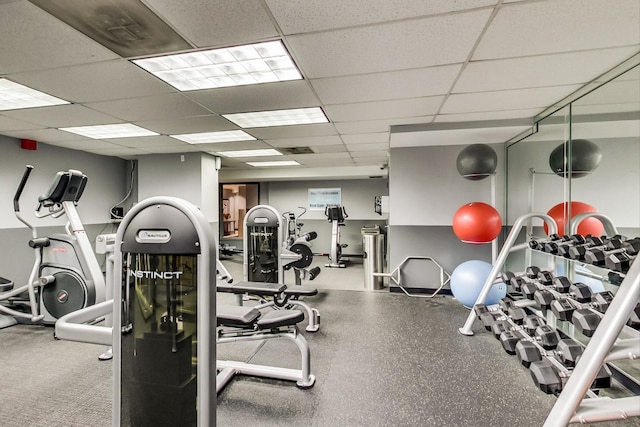 workout area featuring a paneled ceiling