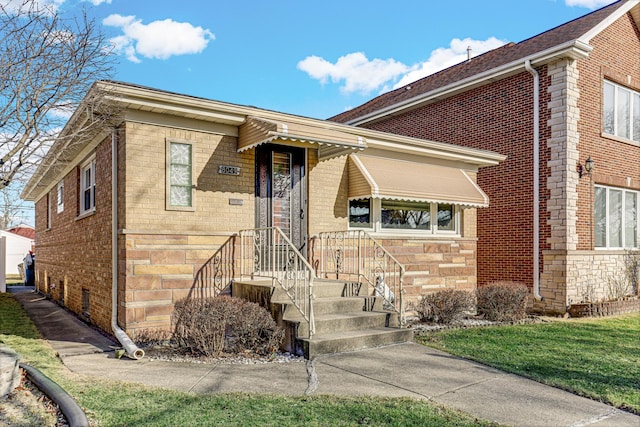 view of front of property with brick siding and stone siding